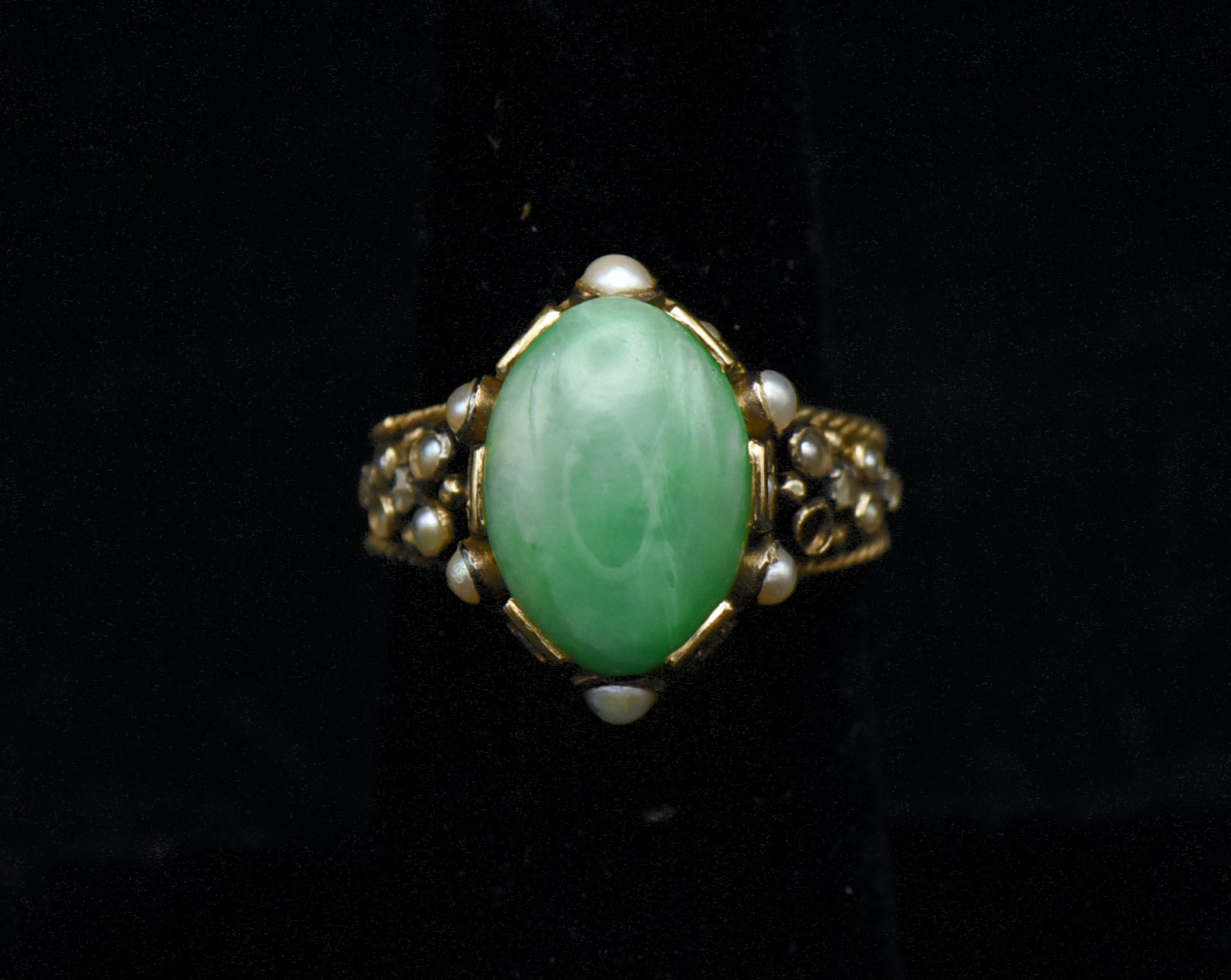 Gorgeous handmade vintage 18k gold ring, set with a lovely oval cabochon of jade, accented with bezel set pearls of various sizes, as well as rose cut diamonds.