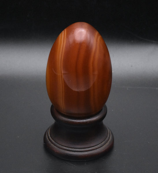 Carved Carnelian Egg on Wood Stand