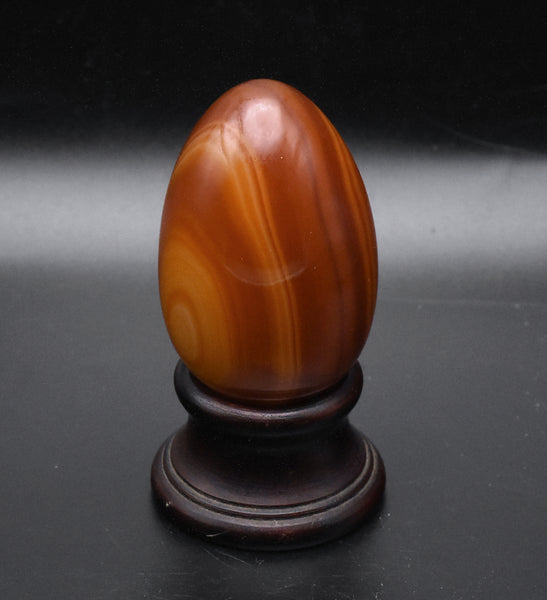 Carved Carnelian Egg on Wood Stand