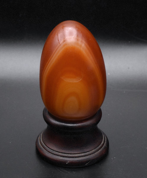 Carved Carnelian Egg on Wood Stand