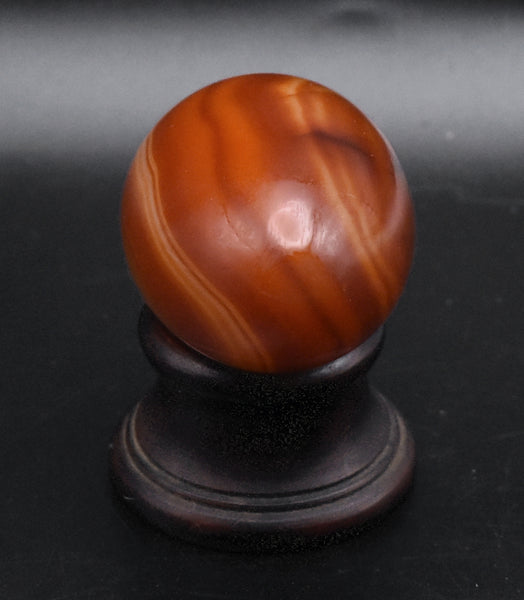 Carved Carnelian Egg on Wood Stand