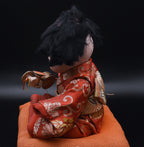 Vintage Ceramic Japanese Doll on Cushion - AS IS