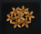Stunning vintage antique handcrafted 18k gold brooch consisting of seven flowers with florentine finish, each set with a round cut sapphire.