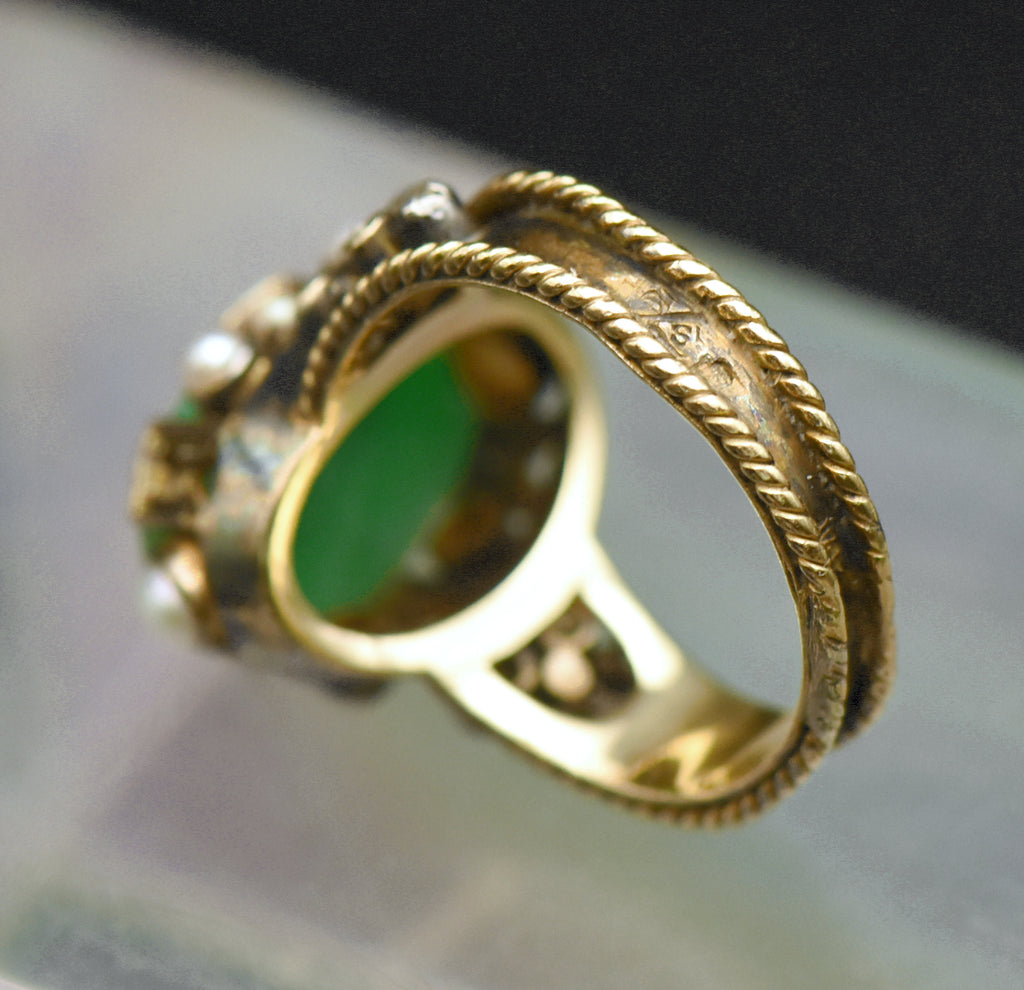 Gorgeous handmade vintage 18k gold ring, set with a lovely oval cabochon of jade, accented with bezel set pearls of various sizes, as well as rose cut diamonds.