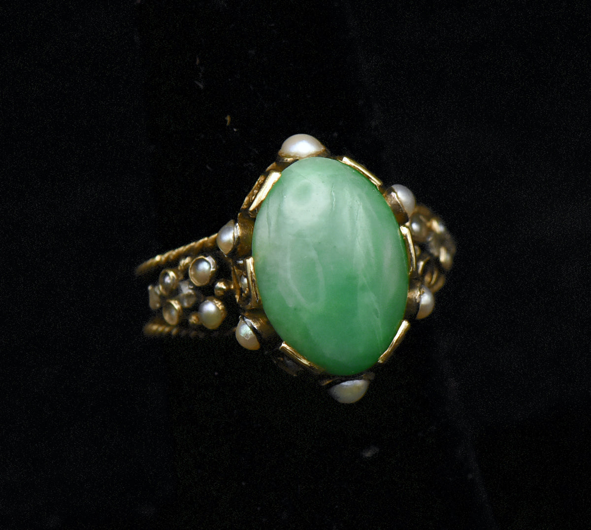 Gorgeous handmade vintage 18k gold ring, set with a lovely oval cabochon of jade, accented with bezel set pearls of various sizes, as well as rose cut diamonds.