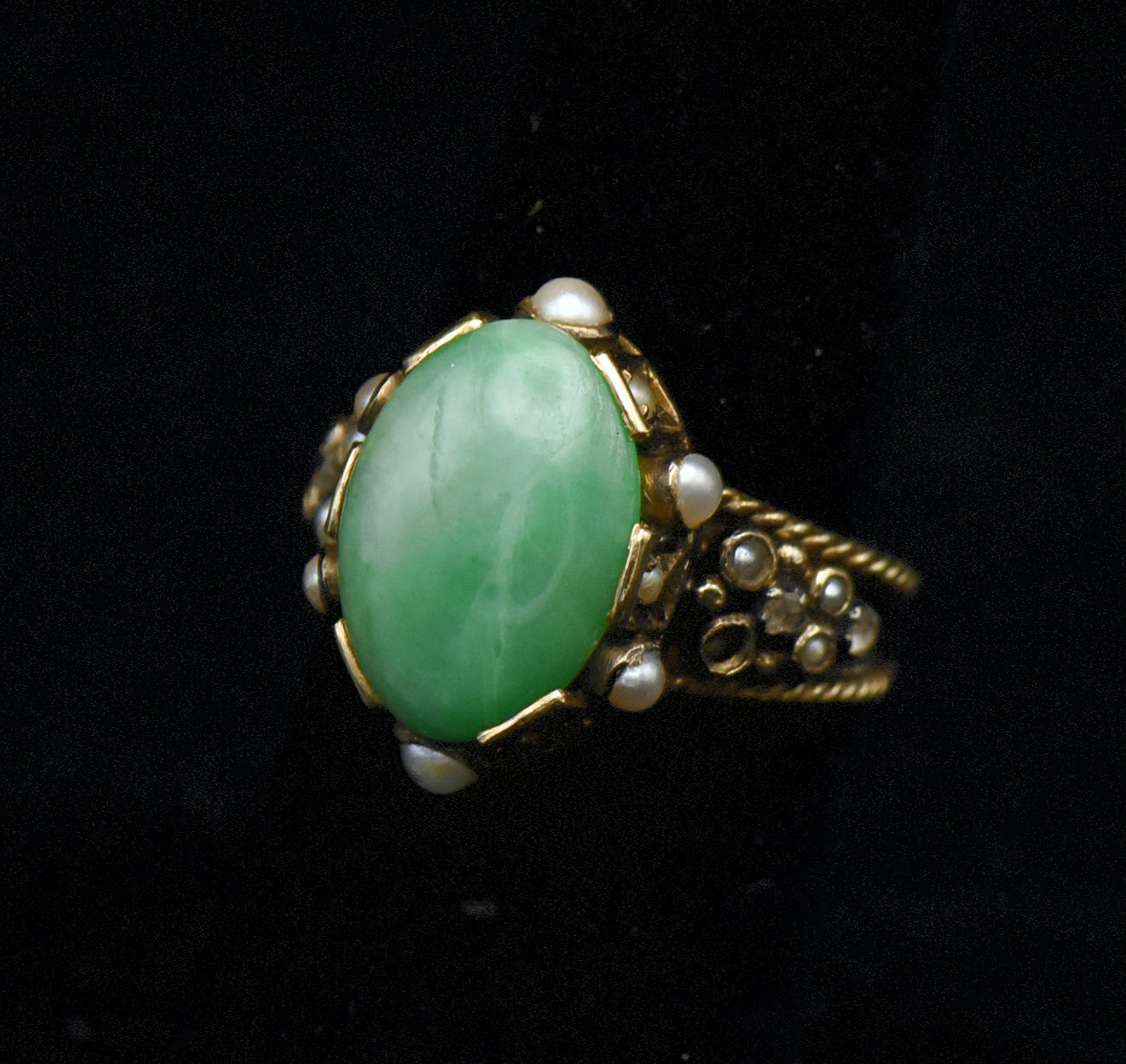 Gorgeous handmade vintage 18k gold ring, set with a lovely oval cabochon of jade, accented with bezel set pearls of various sizes, as well as rose cut diamonds.