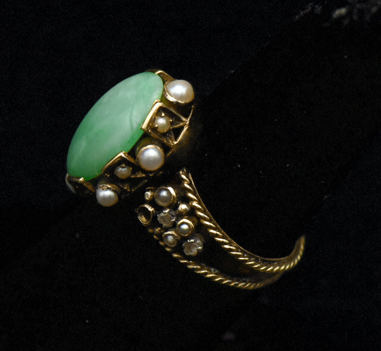 Gorgeous handmade vintage 18k gold ring, set with a lovely oval cabochon of jade, accented with bezel set pearls of various sizes, as well as rose cut diamonds.