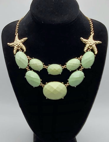 Gold Tone Starfish Necklace with Light Green Faceted Plastic Cabochons