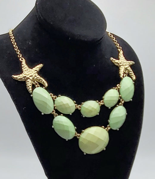 Gold Tone Starfish Necklace with Light Green Faceted Plastic Cabochons