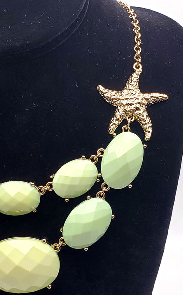 Gold Tone Starfish Necklace with Light Green Faceted Plastic Cabochons