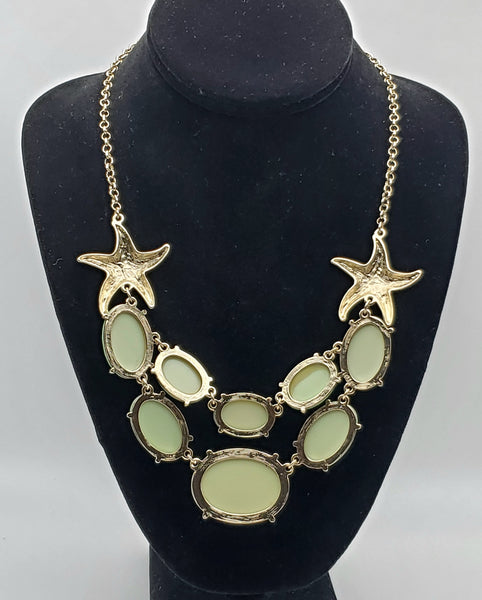 Gold Tone Starfish Necklace with Light Green Faceted Plastic Cabochons