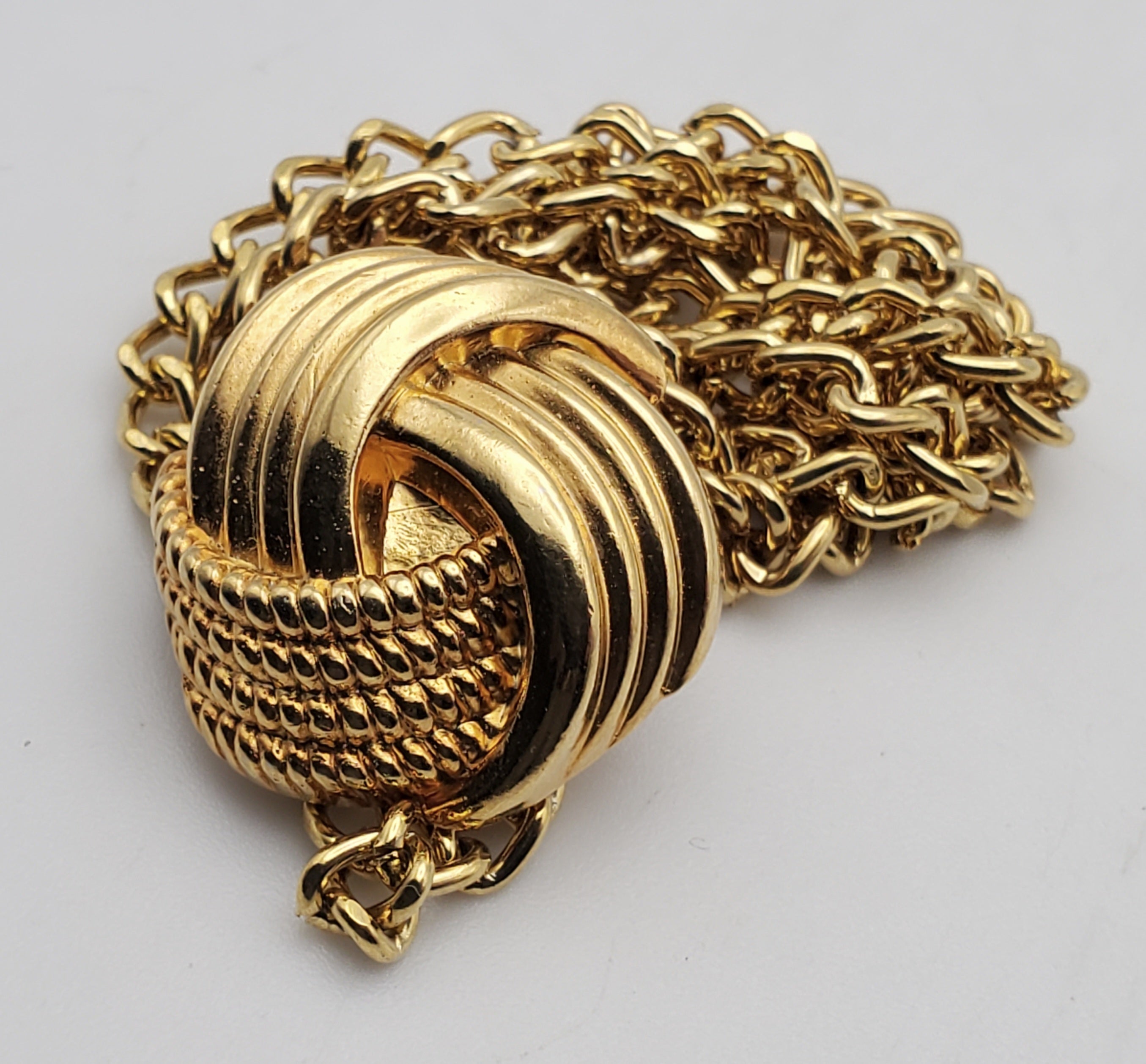 Gold Tone Hanging Button with Tied Knot Motif