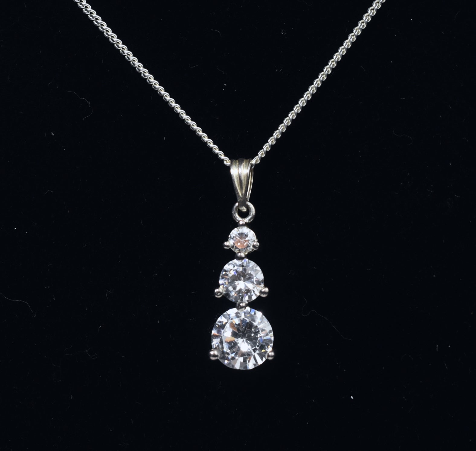 Avon - Sterling Silver Graduated Cubic Zirconia Drop Pendant on Sterling Silver Chain Necklace - 16"