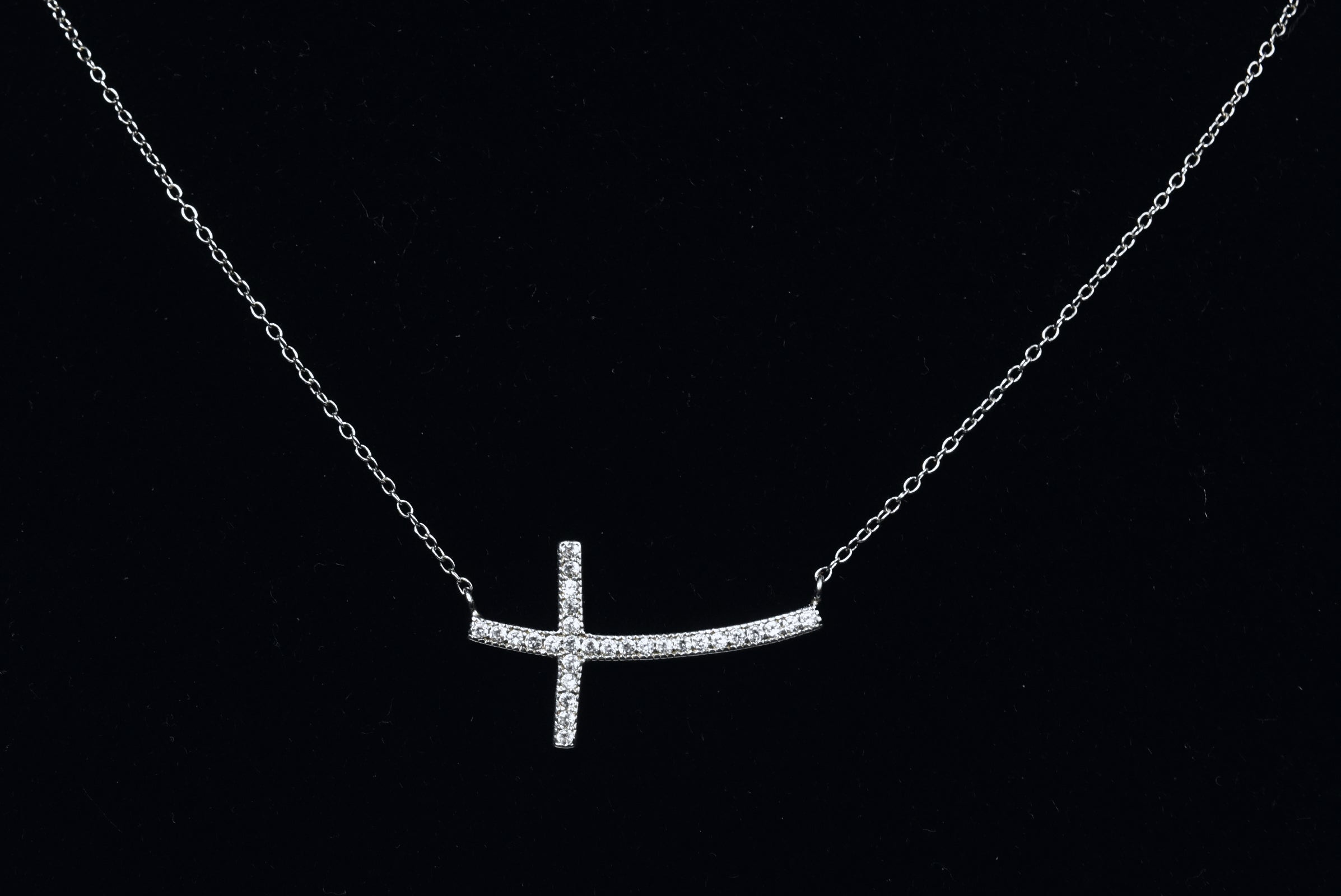 Sterling Silver Curved Crystal Cross Necklace