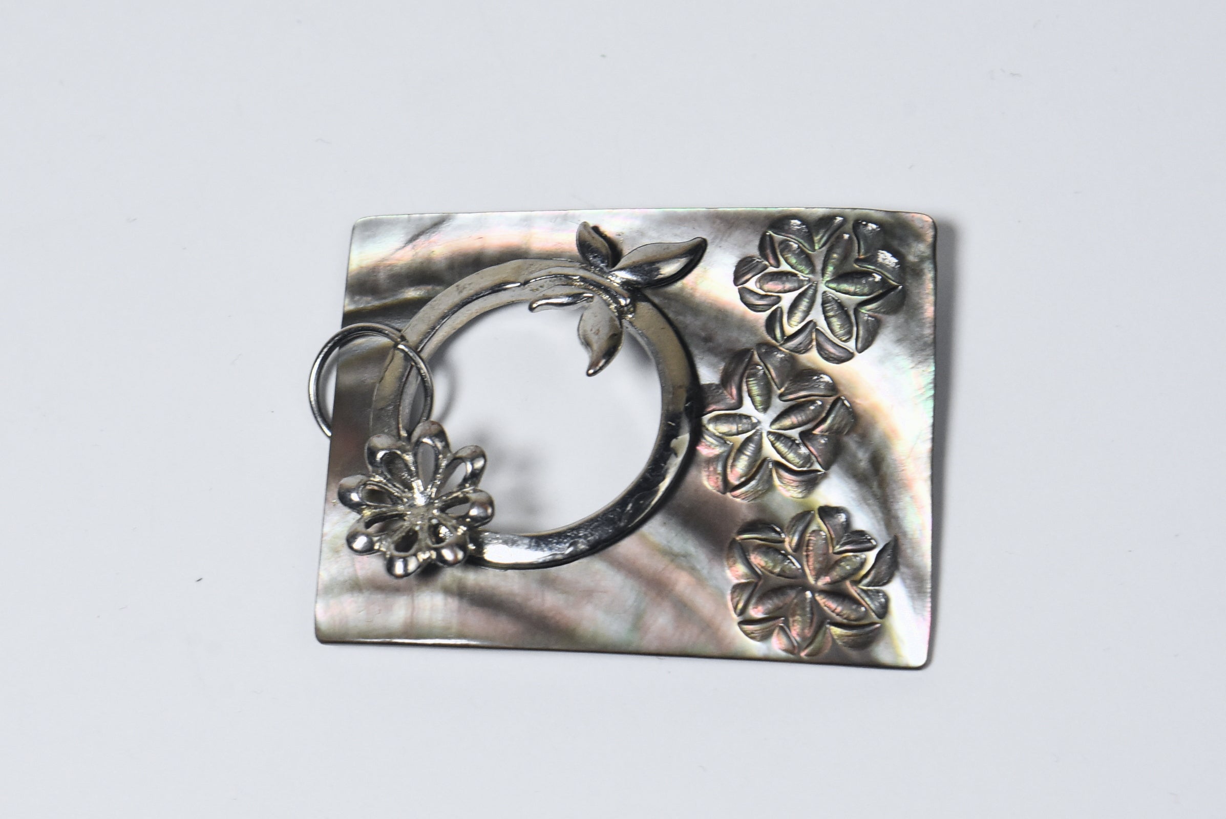 Carved Mother of Pearl Brooch with Silver Butterfly Adornment