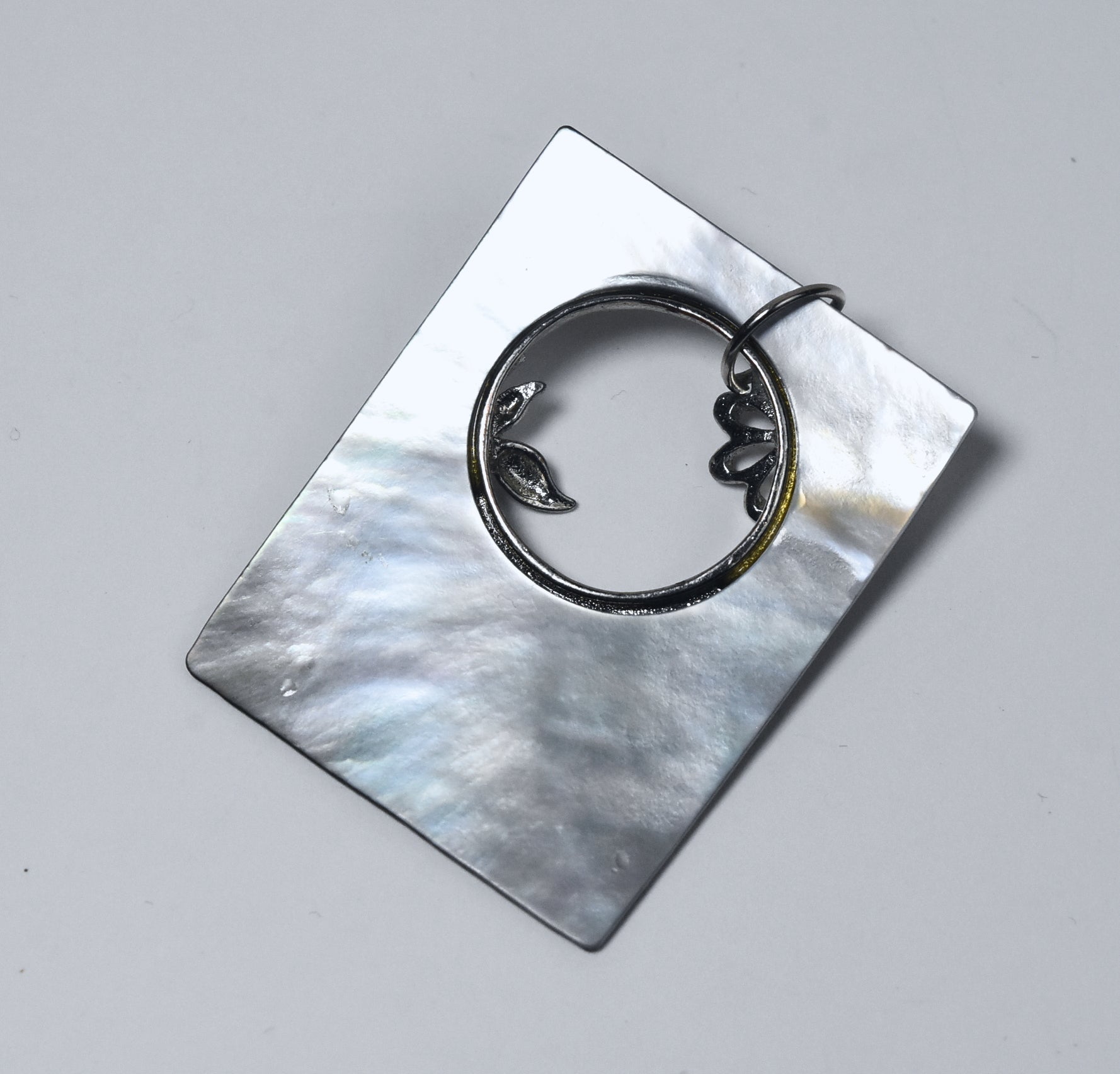 Carved Mother of Pearl Brooch with Silver Butterfly Adornment