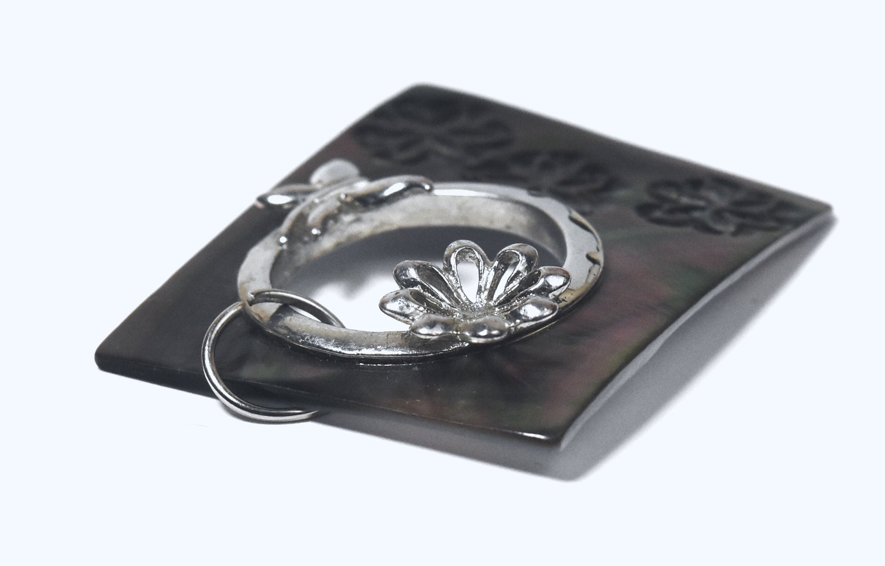 Carved Mother of Pearl Brooch with Silver Butterfly Adornment