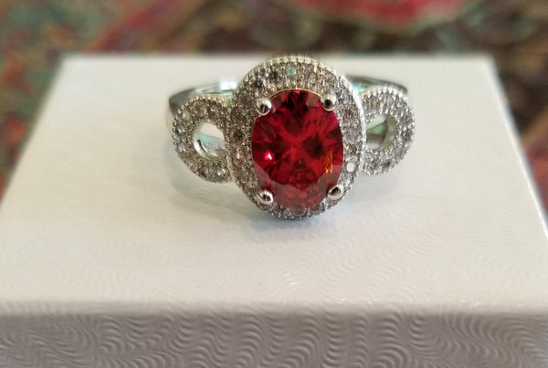 Sterling Silver Ring with Oval Cut Simulated Ruby and Simulated Diamonds