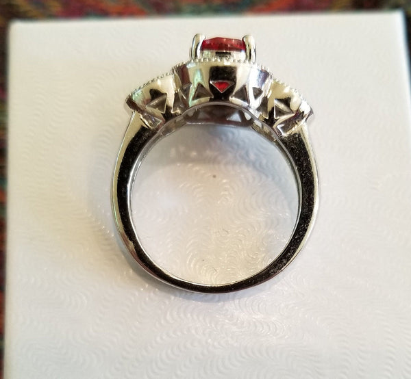 Sterling Silver Ring with Oval Cut Simulated Ruby and Simulated Diamonds