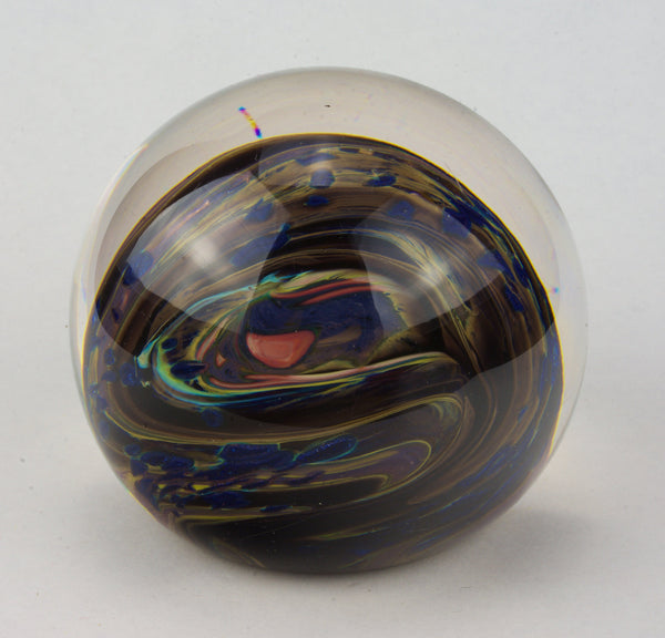 Brown, Yellow, Sparkly Blue and More In this Swirling Glass Paperweight