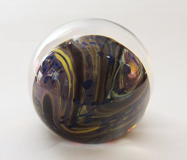 Brown, Yellow, Sparkly Blue and More In this Swirling Glass Paperweight