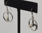 Sterling Silver Dangling Dolphins Hoop Earrings