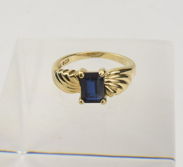 Gold Tone Sterling Silver Ring with Emerald Cut Blue Stone - Size 5.25