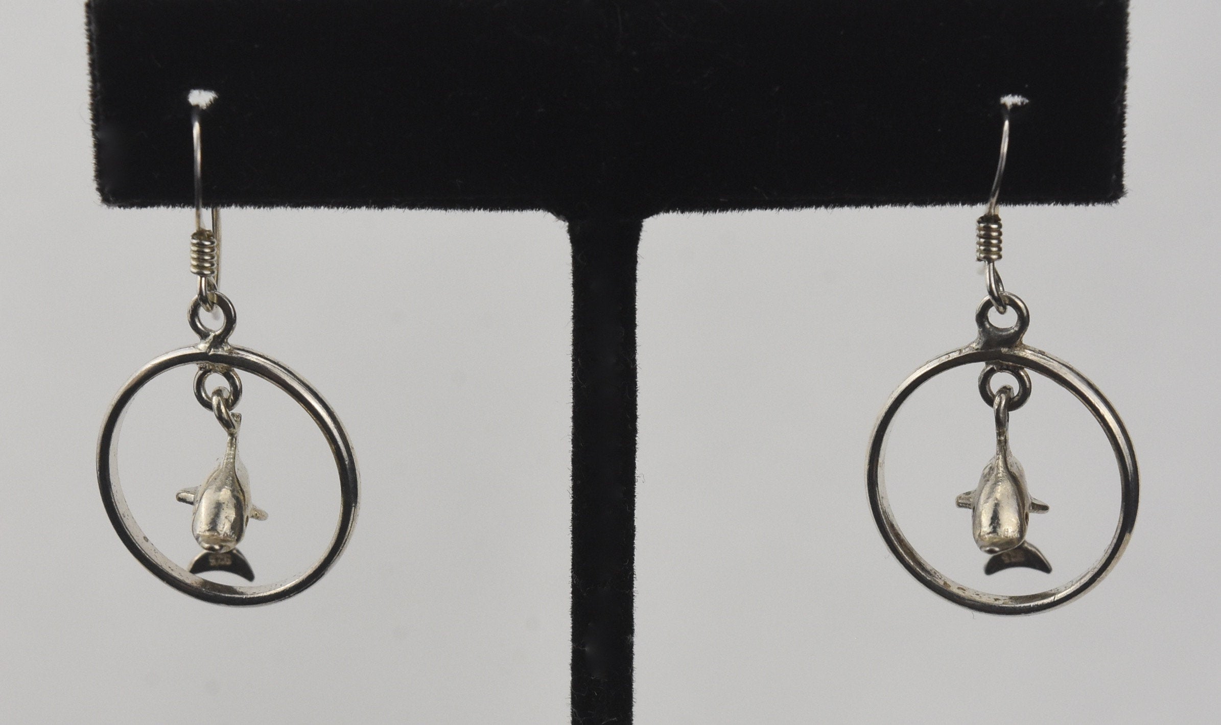 Sterling Silver Dangling Dolphins Hoop Earrings